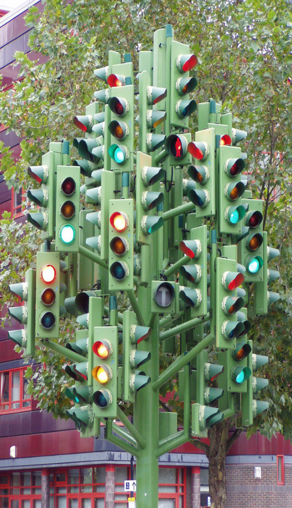A dense cluster of traffic lights with mixed red, yellow, and green signals, illustrating telemetry noise.
