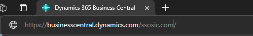 Browser address bar showing Business Central URL using the tenant domain name instead of a GUID.